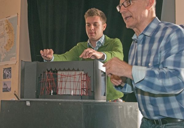 (from left)  Assistant Director Trent Stork helps Jim Corti, Artistic Director at the Photo